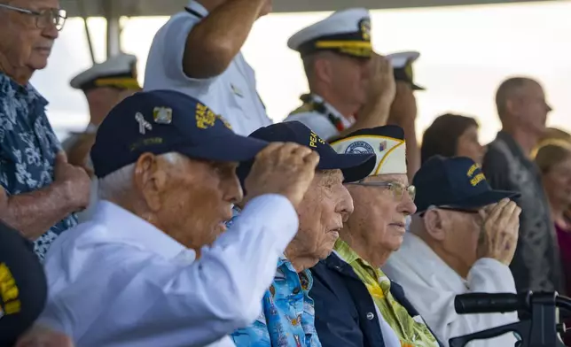 FILE - Pearl Harbor survivors Harry Chandler, from left, Ken Stevens, Herb Elfring and Ira "Ike" Schab salute while the national anthem is played during the 82nd Pearl Harbor Remembrance Day ceremony on Dec. 7, 2023, at Pearl Harbor in Honolulu. (AP Photo/Mengshin Lin, File)