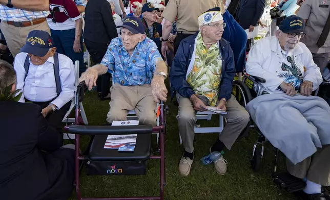 FILE - From left, Pearl Harbor survivors Harry Chandler, Ken Stevens, Herb Elfring and Ira "Ike" Schab during the 82nd Pearl Harbor Remembrance Day ceremony on Dec. 7, 2023, at Pearl Harbor in Honolulu. (AP Photo/Mengshin Lin, File)