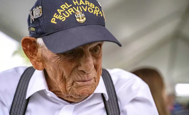 FILE - Pearl Harbor survivor Harry Chandler, 102, of Tequesta, Fla., speaks to the media during the 82nd Pearl Harbor Remembrance Day ceremony on Dec. 7, 2023, at Pearl Harbor in Honolulu. (AP Photo/Mengshin Lin, File)