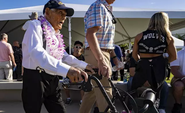 FILE - Pearl Harbor survivor Harry Chandler, 102, of Tequesta, Fla., leaves the 82nd Pearl Harbor Remembrance Day ceremony on Dec. 7, 2023, at Pearl Harbor in Honolulu. (AP Photo/Mengshin Lin, File)