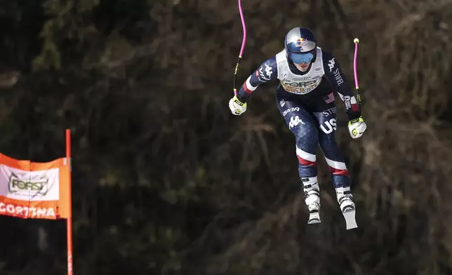 United States' Lindsey Vonn speeds down the course during an alpine ski, women's World Cup downhill training, in Cortina d'Ampezzo, Italy, Thursday, Jan. 16, 2025. (AP Photo/Marco Trovati)