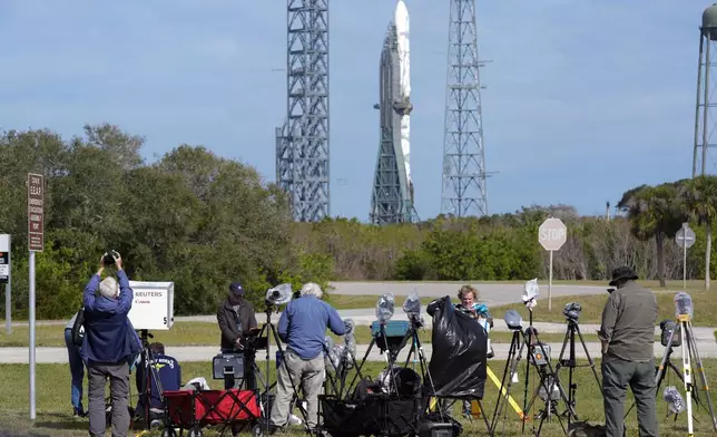 Photographers reset their remote cameras for yet another launch attempt of Blue Origin's New Glenn rocket from Launch Complex 36 at the Cape Canaveral Space Force Station, Wednesday, Jan. 15, 2025, in Cape Canaveral, Fla. (AP Photo/John Raoux)
