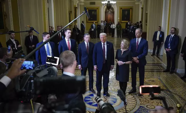 President-elect Donald Trump talks to reporters after a meeting with Republican leadership at the Capitol on Wednesday, Jan. 8, 2025, in Washington. From left, Vice President-elect Sen. JD Vance, R-Ohio, Sen. Tom Cotton, R-Ark., Sen. John Barrasso, R-Wyo., Trump, Sen. Shelley Moore Capito, R-W.Va., and Senate Majority Leader John Thune of S.D. (AP Photo/Steve Helber)