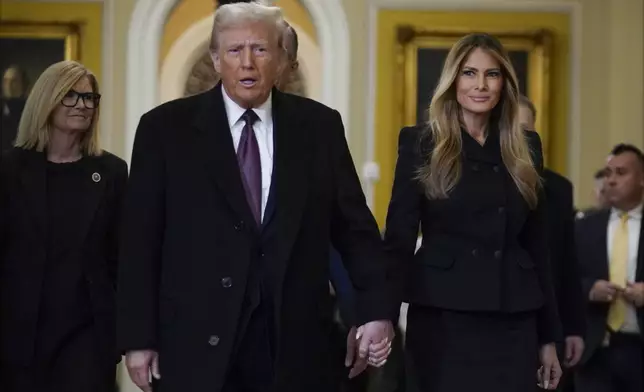 President-elect Donald Trump walks with Melania Trump at the Capitol Wednesday, Jan. 8, 2025, in Washington. (AP Photo/Jose Luis Magana)