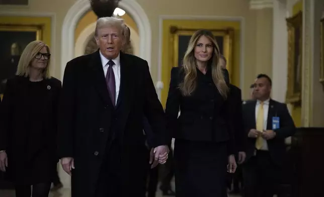 President-elect Donald Trump walks with Melania Trump at the Capitol Wednesday, Jan. 8, 2025, in Washington. (AP Photo/Jose Luis Magana)