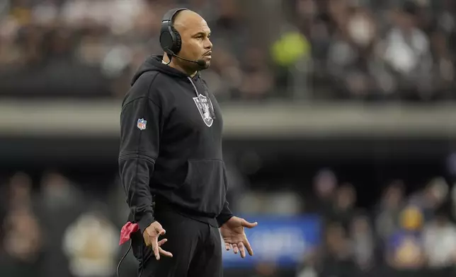 Las Vegas Raiders head coach Antonio Pierce reacts during the first half of an NFL football game against the Los Angeles Chargers in Las Vegas, Sunday, Jan. 5, 2025. (AP Photo/Abbie Parr)