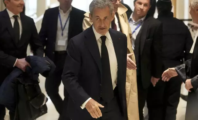 Former French President Nicolas Sarkozy arrives as he goes on trial over alleged illegal financing of his 2007 presidential campaign by the government of late Libyan leader Moammar Gadhafi, Monday, Jan. 6, 2025 in Paris. (AP Photo/Thibault Camus)