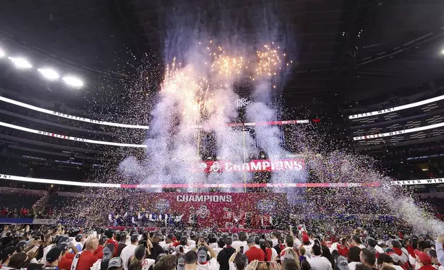 People celebrate after Ohio State defeated Texas in the Cotton Bowl College Football Playoff semifinal game, Friday, Jan. 10, 2025, in Arlington, Texas. (AP Photo/Gareth Patterson)