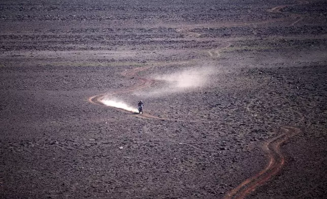 A rider competes during the fourth stage of the Dakar Rally between Al Henakiyah and Alula, Saudi Arabia, Wednesday, Jan. 8, 2025. (AP Photo/Christophe Ena)