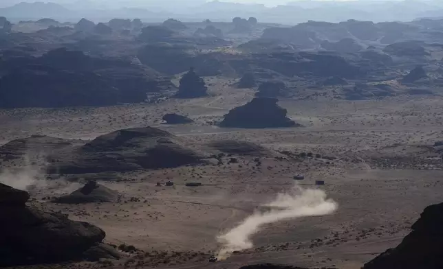 A driver competes during the fourth stage of the Dakar Rally between Al Henakiyah and Alula, Saudi Arabia, Wednesday, Jan. 8, 2025. (AP Photo/Christophe Ena)