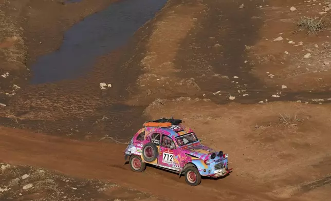 Driver Barbora Holicka and co-driver Lucie Engova drive their Citroen 2CV during the eighth stage of the Dakar Rally Classic between Al Duwadimi and Riyadh, Saudi Arabia, Monday, Jan. 13, 2025. (AP Photo/Christophe Ena)