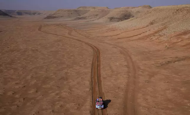 Driver Barbora Holicka and co-driver Lucie Engova drive their Citroen 2CV during the eighth stage of the Dakar Rally Classic between Al Duwadimi and Riyadh, Saudi Arabia, Monday, Jan. 13, 2025. (AP Photo/Christophe Ena)