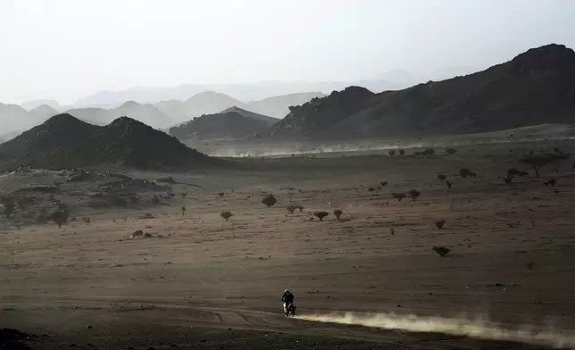 A rider competes during the prologue of the Dakar Rally in Bisha, Saudi Arabia, Friday, Jan. 3, 2025. (AP Photo/Christophe Ena)