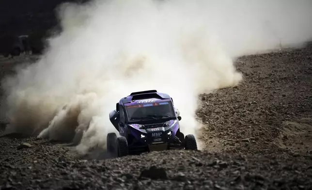 Driver Benjamin Favre and co-driver Thibaud Darroux compete during the prologue of the Dakar Rally in Bisha, Saudi Arabia, Friday, Jan. 3, 2025. (AP Photo/Christophe Ena)