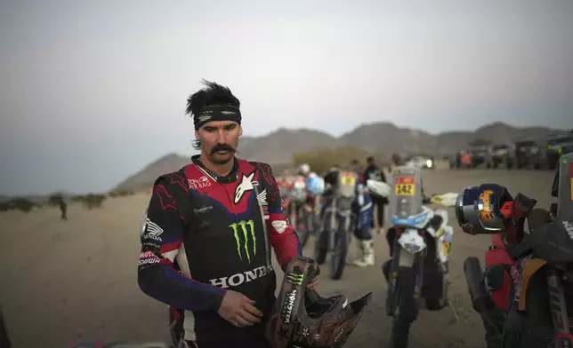 Honda rider Skyler Howes of the U.S arrives at the bivouac after the stage two, day one, of the Dakar Rally with start in Bisha and finish in Bisha, Saudi Arabia, Sunday, Jan. 5, 2025. (AP Photo/Christophe Ena)