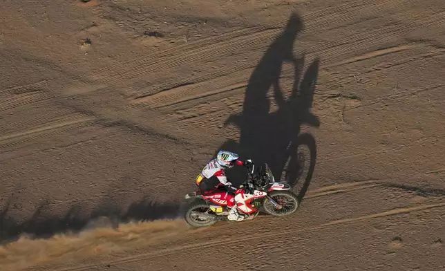 Ross Branch of Botswana rides during the third stage of the Dakar Rally between Bisha and Al-Henakiyah, Saudi Arabia, Tuesday, Jan. 7, 2025. (AP Photo/Christophe Ena)