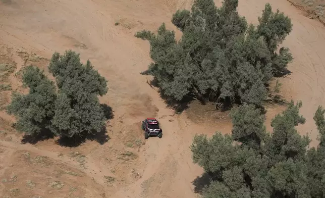 Daccia driver Nasser Al-Attiyah and co-driver Edouard Boulanger compete during the sixth stage of the Dakar Rally between Hail and Al Duwadimi, Saudi Arabia, Saturday, Jan. 11, 2025. (AP Photo/Christophe Ena)
