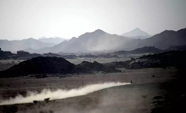 A rider competes during the prologue of the Dakar Rally in Bisha, Saudi Arabia, Friday, Jan. 3, 2025. (AP Photo/Christophe Ena)