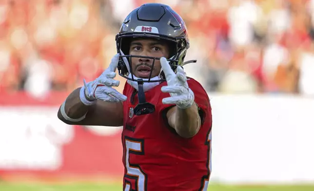 Tampa Bay Buccaneers wide receiver Jalen McMillan (15) makes a gesture after a first down during the second half of an NFL football game against the New Orleans Saints Sunday, Jan. 5, 2025, in Tampa, Fla. (AP Photo/Jason Behnken)