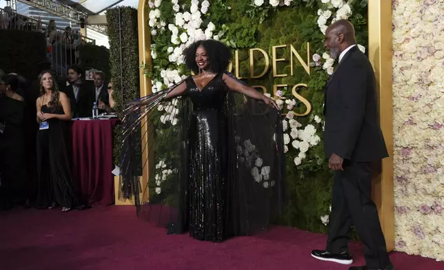 Viola Davis, left, and Julius Tennon arrive at the 82nd Golden Globes on Sunday, Jan. 5, 2025, at the Beverly Hilton in Beverly Hills, Calif. (Photo by Jordan Strauss/Invision/AP)