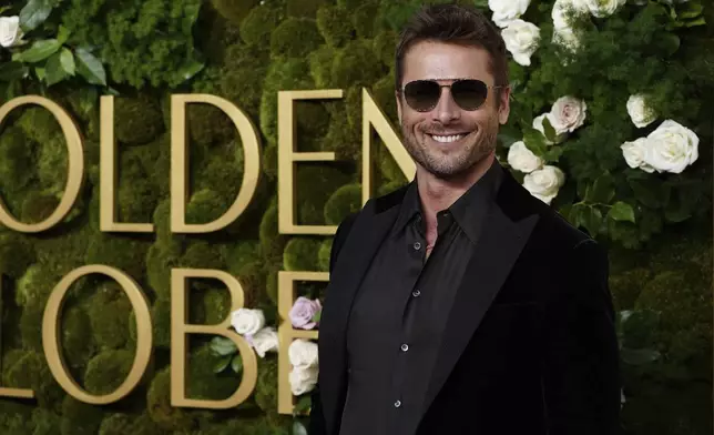 Glen Powell arrives at the 82nd Golden Globes on Sunday, Jan. 5, 2025, at the Beverly Hilton in Beverly Hills, Calif. (Photo by Jordan Strauss/Invision/AP)