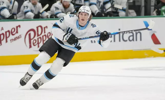 Utah Hockey Club center Logan Cooley skates against the Dallas Stars during the first period of an NHL hockey game, Saturday, Jan. 4, 2025, in Dallas. (AP Photo/Julio Cortez)