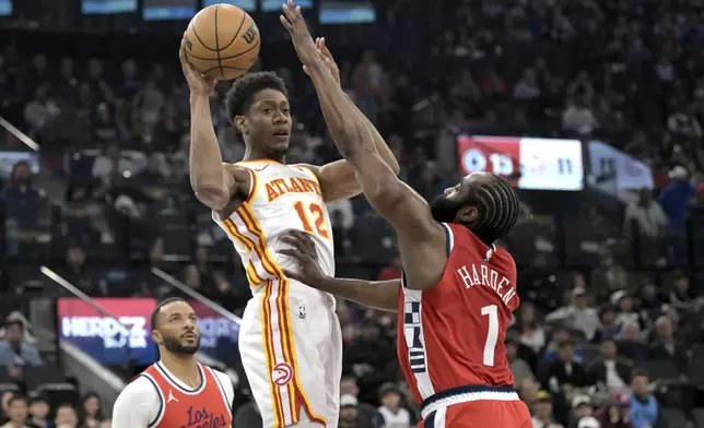 Atlanta Hawks forward De'Andre Hunter is defended by Los Angeles Clippers guard James Harden during the first half of an NBA basketball game Saturday, Jan. 4, 2025, in Los Angeles. (AP Photo/Jayne-Kamin-Oncea)