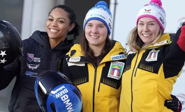 Second placed Kaysha Love, of the United States, winner Lisa Buckwitz, of Germany, and third placed Laura Nolte, of Germany, from left, pose together after competing in the women's monobob at the Bobsleigh World Cup in Innsbruck, Austria, Saturday, Jan. 18, 2025. (AP Photo/Matthias Schrader)