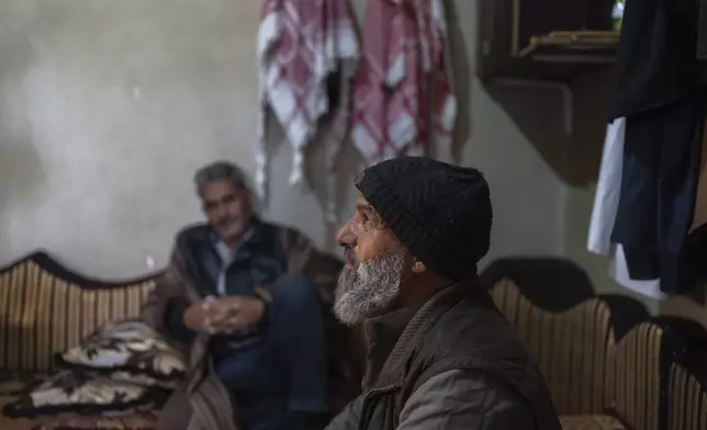 Adel Subhi al-Ali, a local Sunni religious official, whose 21 year old son was shot in the abdomen at a protest against the Israeli military incursion into his village of Swisah, on the outskirts of Quneitra, Syria, Sunday, Jan. 5, 2025. (AP Photo/Mosa'ab Elshamy)