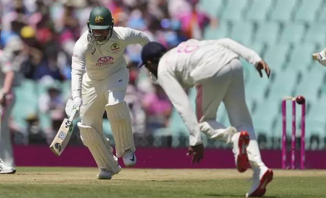 Australia's Usman Khawaja runs to make his ground during play on the third day of the fifth cricket test between India and Australia at the Sydney Cricket Ground, in Sydney, Australia, Sunday, Jan. 5, 2025. (AP Photo/Mark Baker)