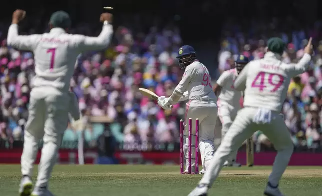 India's Jasprit Bumrah reacts as he is out bowled during play on the third day of the fifth cricket test between India and Australia at the Sydney Cricket Ground, in Sydney, Australia, Sunday, Jan. 5, 2025. (AP Photo/Mark Baker)