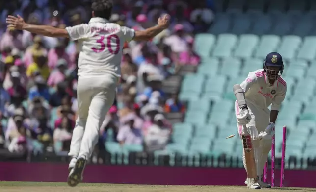 India's Washington Sundar is out bowled by Australia's captain Pat Cummins during play on the third day of the fifth cricket test between India and Australia at the Sydney Cricket Ground, in Sydney, Australia, Sunday, Jan. 5, 2025. (AP Photo/Mark Baker)