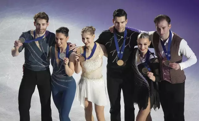 Pairs gold medalist Minerva Fabienne Hase and Nikita Volodin of Germany, centre, silver medalists Sara Conti and Niccolo Macii of Italy, left, and bronze medalist Anastasiia Metelkina and Luka Berulava of Georgia pose with their medals during the victory ceremony for pairs short program competition at the ISU European Figure Skating Championships in Tallinn, Estonia, Thursday, Jan. 30, 2025. (AP Photo/Sergei Grits)