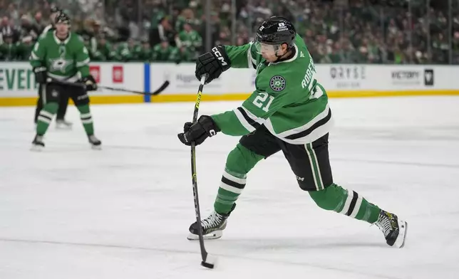 Dallas Stars left wing Jason Robertson collects an assist on a shot that lead to teammate's center Roope Hintz goal against the Ottawa Senators during the first period of an NHL hokey game, Thursday, Jan. 2, 2025, in Dallas. (AP Photo/Julio Cortez)