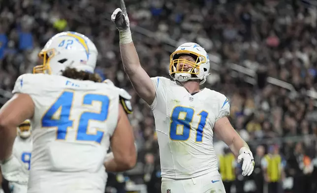 Los Angeles Chargers tight end Will Dissly (81) celebrates after scoring against the Las Vegas Raiders during the second half of an NFL football game in Las Vegas, Sunday, Jan. 5, 2025. (AP Photo/John Locher)