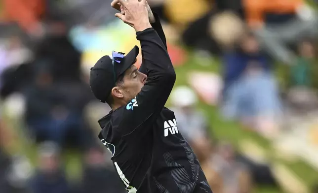 New Zealand's Mitchell Santner takes a catch to dismiss Sri Lanka's Wanindu Hasaranga during the first ODI international cricket match between New Zealand and Sri Lanka at the Basin Reserve in Wellington, New Zealand Sunday, Jan. 5, 2025. (Kerry Marshall/Photosport via AP)