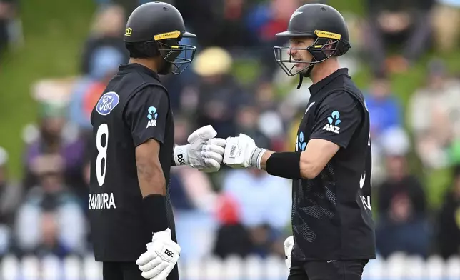 New Zealand's Rachin Ravindra and Will Young react during the first ODI international cricket match between New Zealand and Sri Lanka at the Basin Reserve in Wellington, New Zealand Sunday, Jan. 5, 2025. (Kerry Marshall/Photosport via AP)