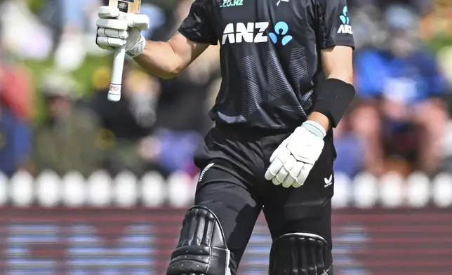 New Zealand's Will Young celebrates scoring 50 runs during the first ODI international cricket match between New Zealand and Sri Lanka at the Basin Reserve, Wellington, New Zealand, Sunday, Jan. 5, 2025. (Kerry Marshall/Photosport via AP)