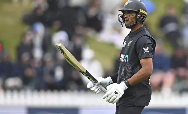 New Zealand's Rachin Ravindra leaves the field after being caught by Sri Lanka's Wanindu Hasaranga during the first ODI international cricket match between New Zealand and Sri Lanka at the Basin Reserve in Wellington, New Zealand Sunday, Jan. 5, 2025. (Kerry Marshall/Photosport via AP)