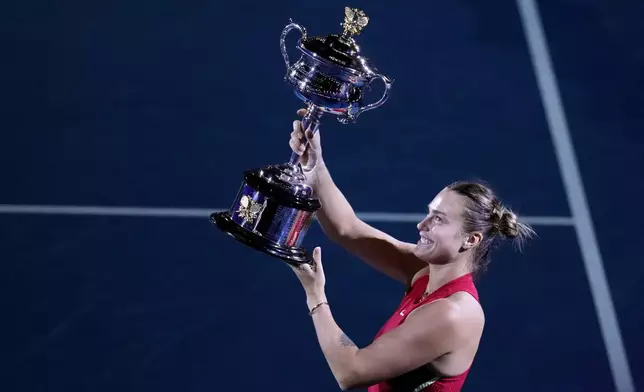 FILE - Aryna Sabalenka of Belarus holds the Daphne Akhurst Memorial Cup after defeating Zheng Qinwen of China in the women's singles final at the Australian Open tennis championships at Melbourne Park, Melbourne, Australia, Jan. 27, 2024. (AP Photo/Alessandra Tarantino, File)