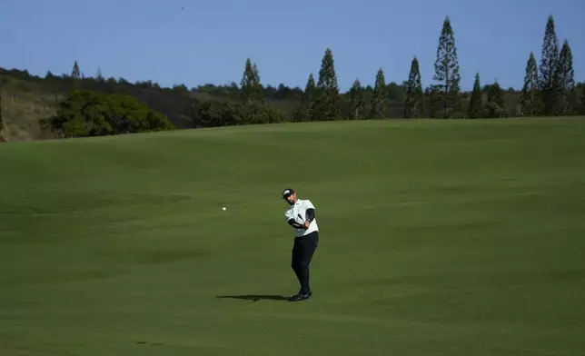 Matthieu Pavon, of France, hits from the 12th fairway during the first round of The Sentry golf event, Thursday, Jan. 2, 2025, at Kapalua Plantation Course in Kapalua, Hawaii. (AP Photo/Matt York)