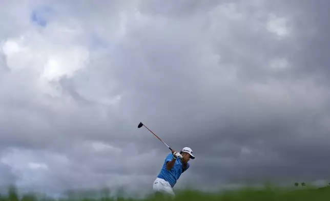 Hideki Matsuyama, of Japan, hits from the 13th tee during the first round of The Sentry golf event, Thursday, Jan. 2, 2025, at Kapalua Plantation Course in Kapalua, Hawaii. (AP Photo/Matt York)