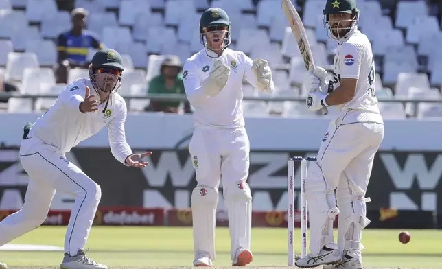 South Africa's David Bedingham and South Africa's Kyle Verreynne appeal the wicket of Pakistan's Salman Agha during the fourth day of the second test match between South Africa and Pakistan in Cape Town, South Africa, Monday, Jan. 6, 2025. (AP Photo/Halden Krog)