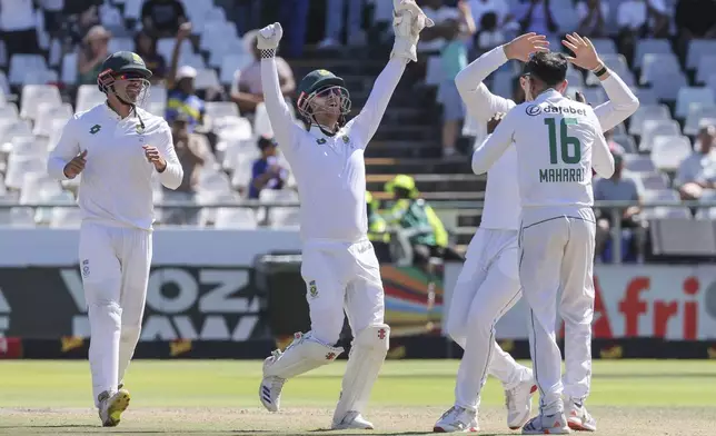 South Africa celebrate the wicket of Pakistan's Mohammad Rizwan during the fourth day of the second test match between South Africa and Pakistan in Cape Town, South Africa, Monday, Jan. 6, 2025. (AP Photo/Halden Krog)