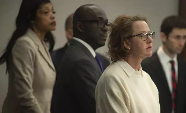 Former Brunswick Judicial Circuit Jackie Johnson stands with her defense team as court opens Thursday, Jan. 30, 2025, in Brunswick, Ga., where she is being tried on charges of violating her oath of office and obstruction of justice in the death of Ahmaud Arbery. (Terry Dickson/The Brunswick News via AP, Pool)