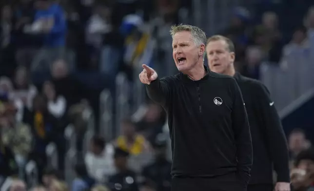 Golden State Warriors head coach Steve Kerr gestures during the first half of an NBA basketball game against the Miami Heat, Tuesday, Jan. 7, 2025, in San Francisco. (AP Photo/Godofredo A. Vásquez)