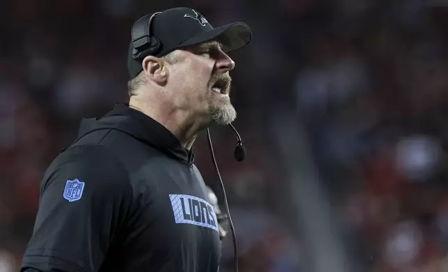 Detroit Lions head coach Dan Campbell yells from the sideline during the first half of an NFL football game against the San Francisco 49ers, Monday, Dec. 30, 2024, in Santa Clara, Calif. (AP Photo/Jed Jacobsohn)