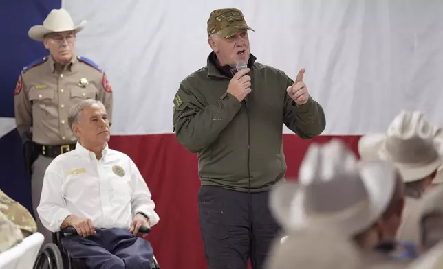 FILE - Incoming U.S. Border Czar Tom Homan, right, stands with Texas Gov. Greg Abbott, left, as he makes statements before serving meals to state troopers and national guardsmen taking part in Operation Lone Star at a facility on the U.S.-Mexico border on Nov. 26, 2024, in Eagle Pass, Texas. (AP Photo/Eric Gay, File)