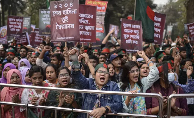 Participants, mostly students, shout slogans during "March for Unity" organized by The Anti-Discrimination Student Movement at the Central Shaheed Minar, a national monument, in Dhaka, Bangladesh, Tuesday, Dec. 31, 2024. (AP Photo/Mahmud Hossain Opu)