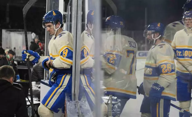 St. Louis Blues center Alexandre Texier (9) leaves the ice after the second period of the NHL Winter Classic outdoor hockey game against the Chicago Blackhawks at Wrigley Field, Tuesday, Dec. 31, 2024, in Chicago. (AP Photo/Erin Hooley)